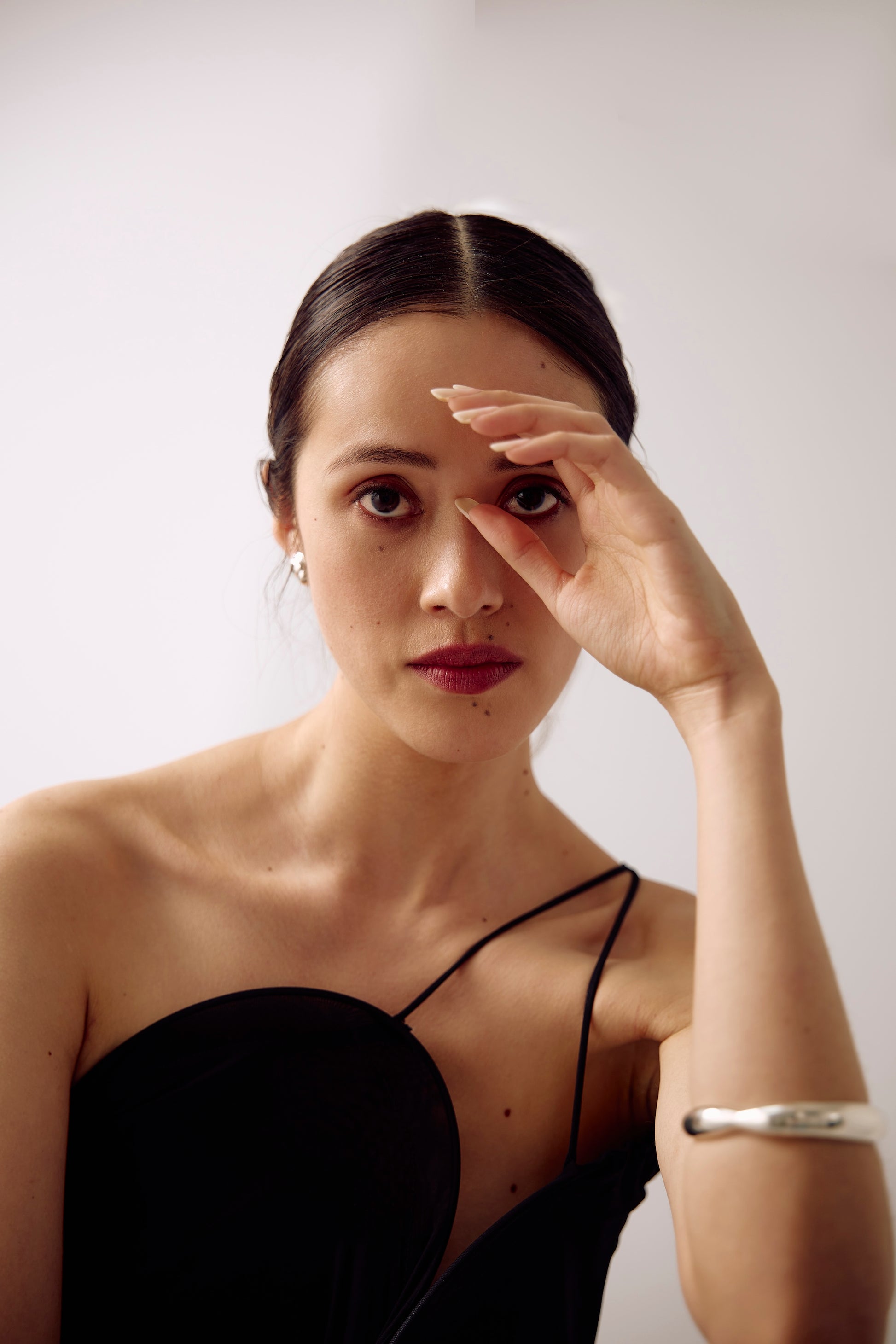 Model wearing the Agnes Bracelet, a bracelet cuff in sterling silver sculptured in lost wax