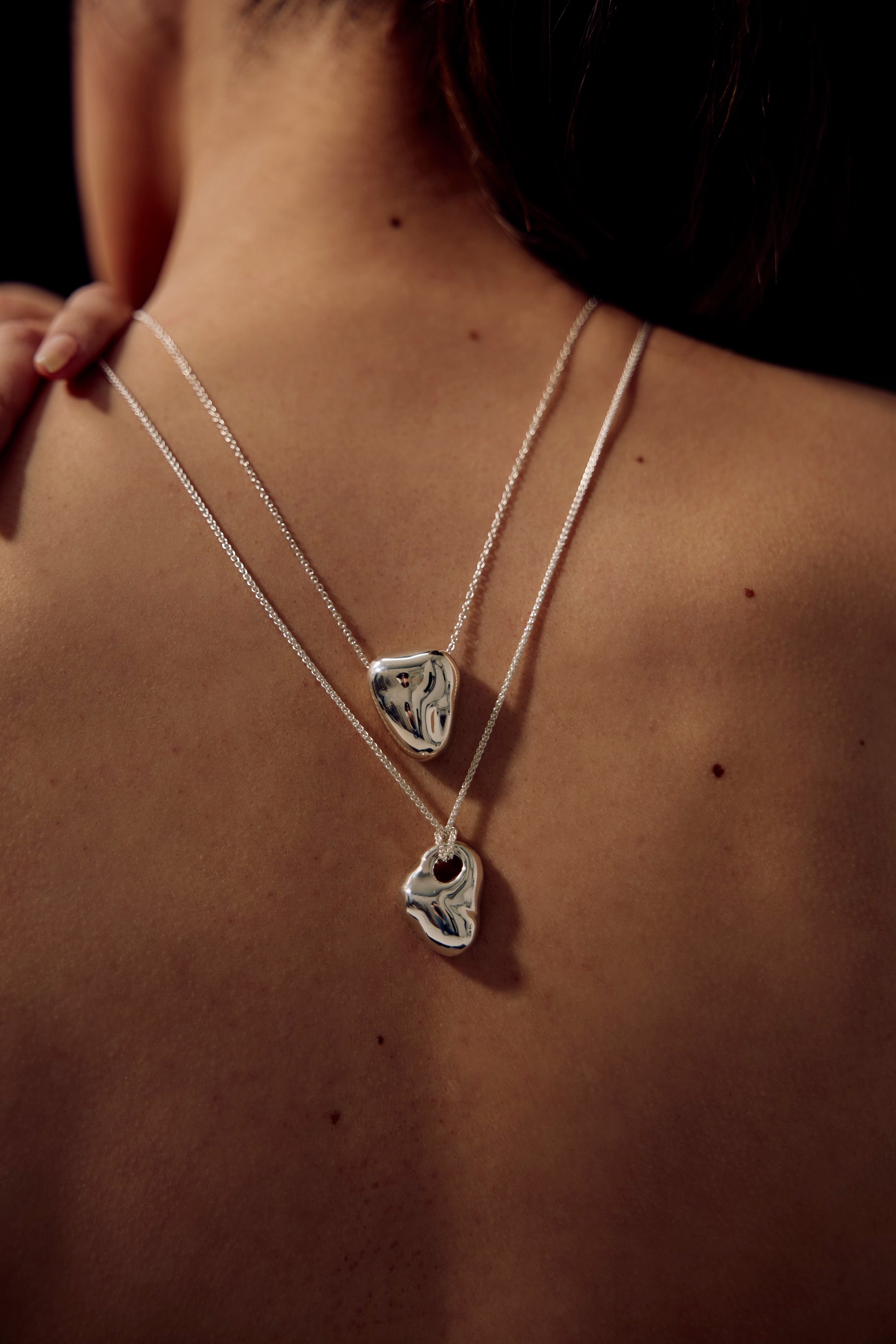 SÉOLA Atelier’s heart pendant, a handcrafted silver pendant with w beautiful mirror polish and shaped like a human heart