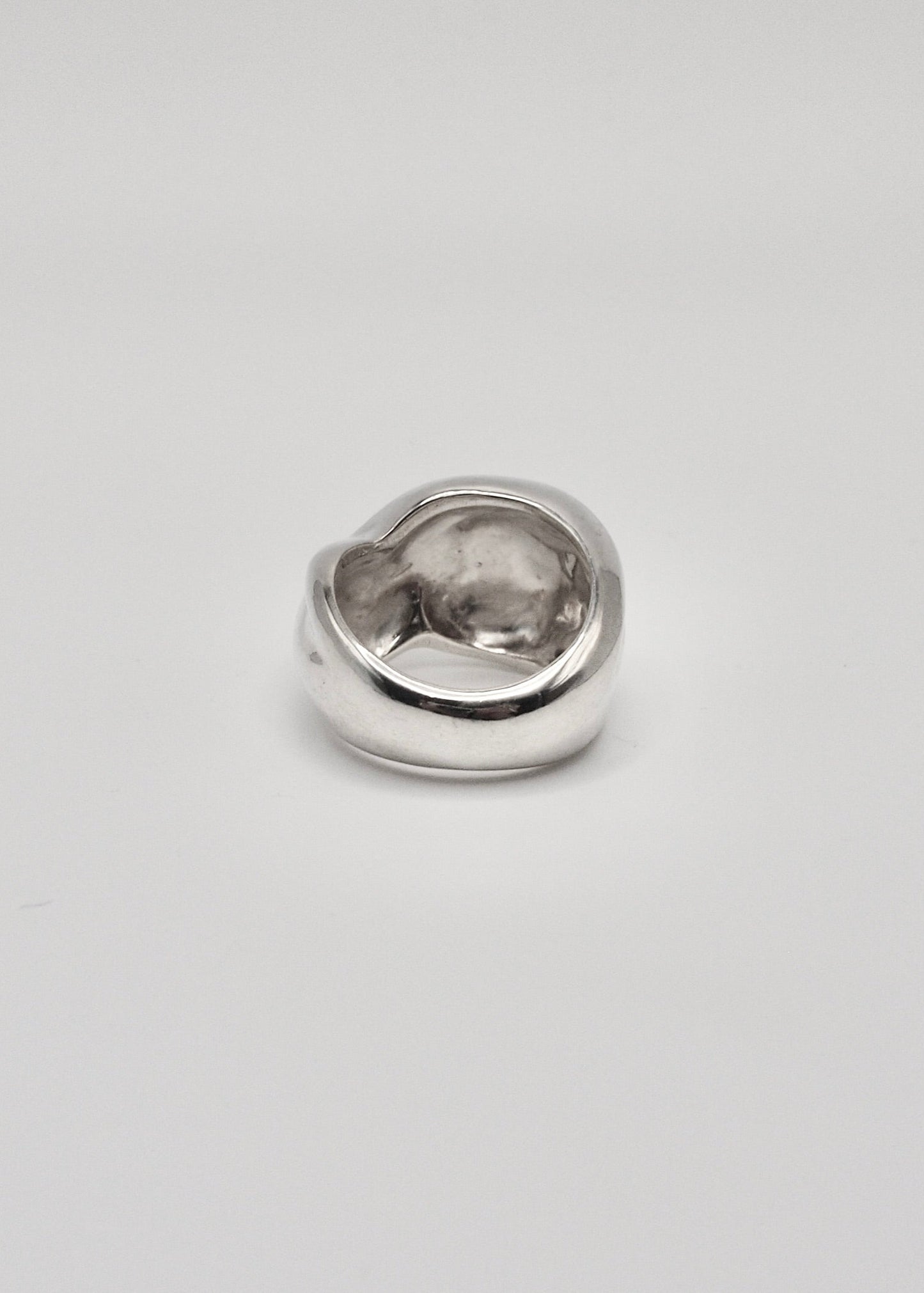 Detailed back view of the Marianne Ring, focusing on its intricate craftsmanship and the reflective quality of the 925 sterling silver.