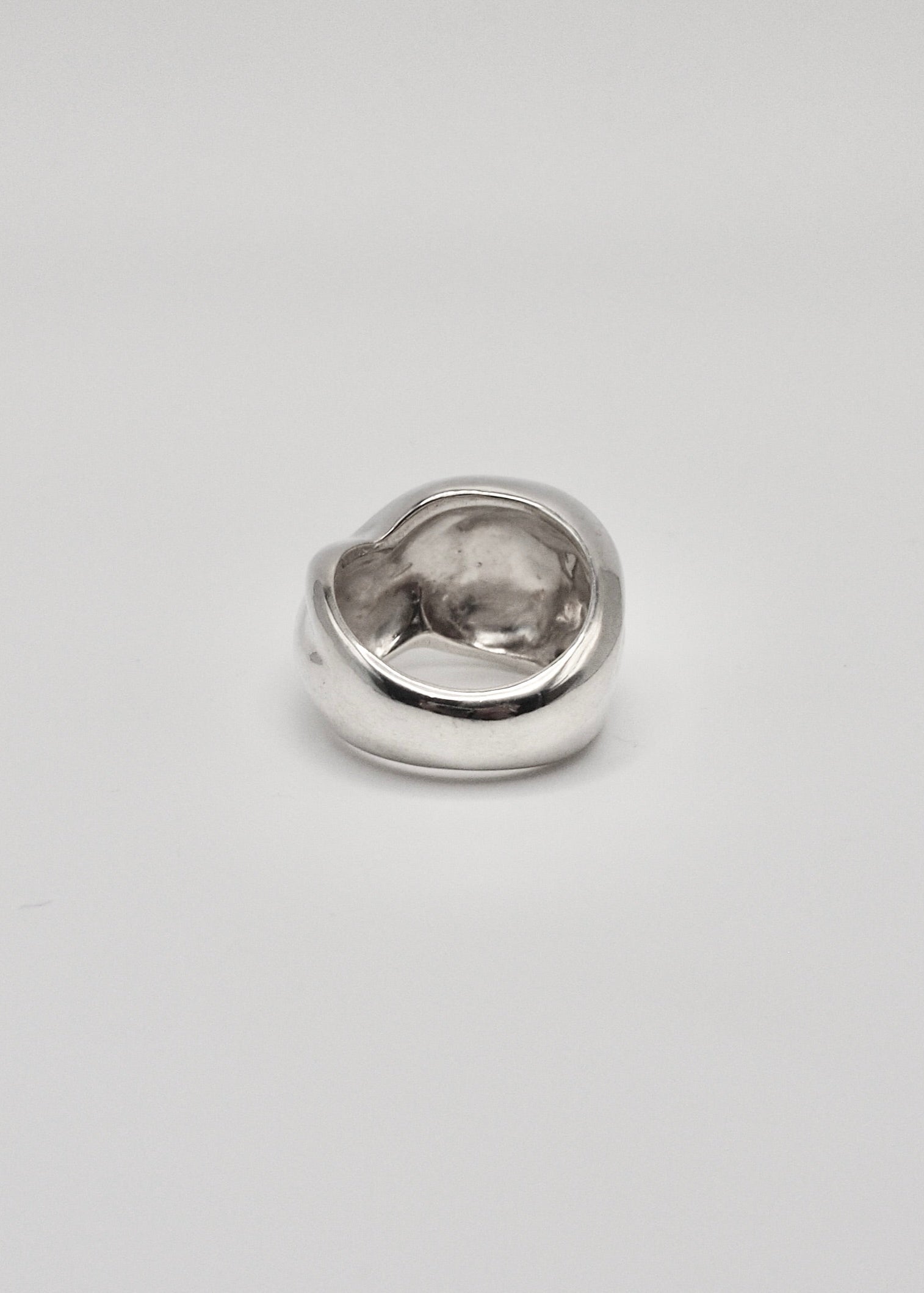 Detailed back view of the Marianne Ring, focusing on its intricate craftsmanship and the reflective quality of the 925 sterling silver.