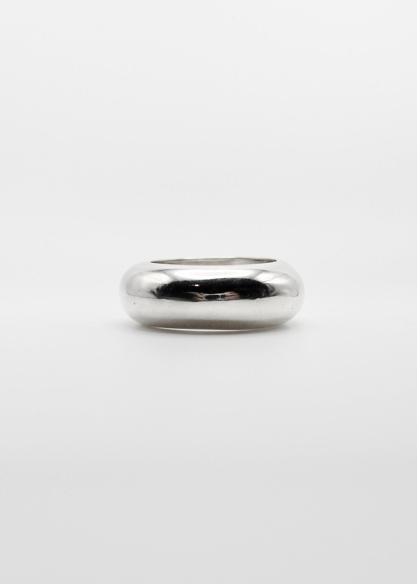 Detailed view of the Nilou Ring, focusing on its 8.5mm width and the reflective quality of the 925 sterling silver. statement ring worn alone or together with its little sister Jooni