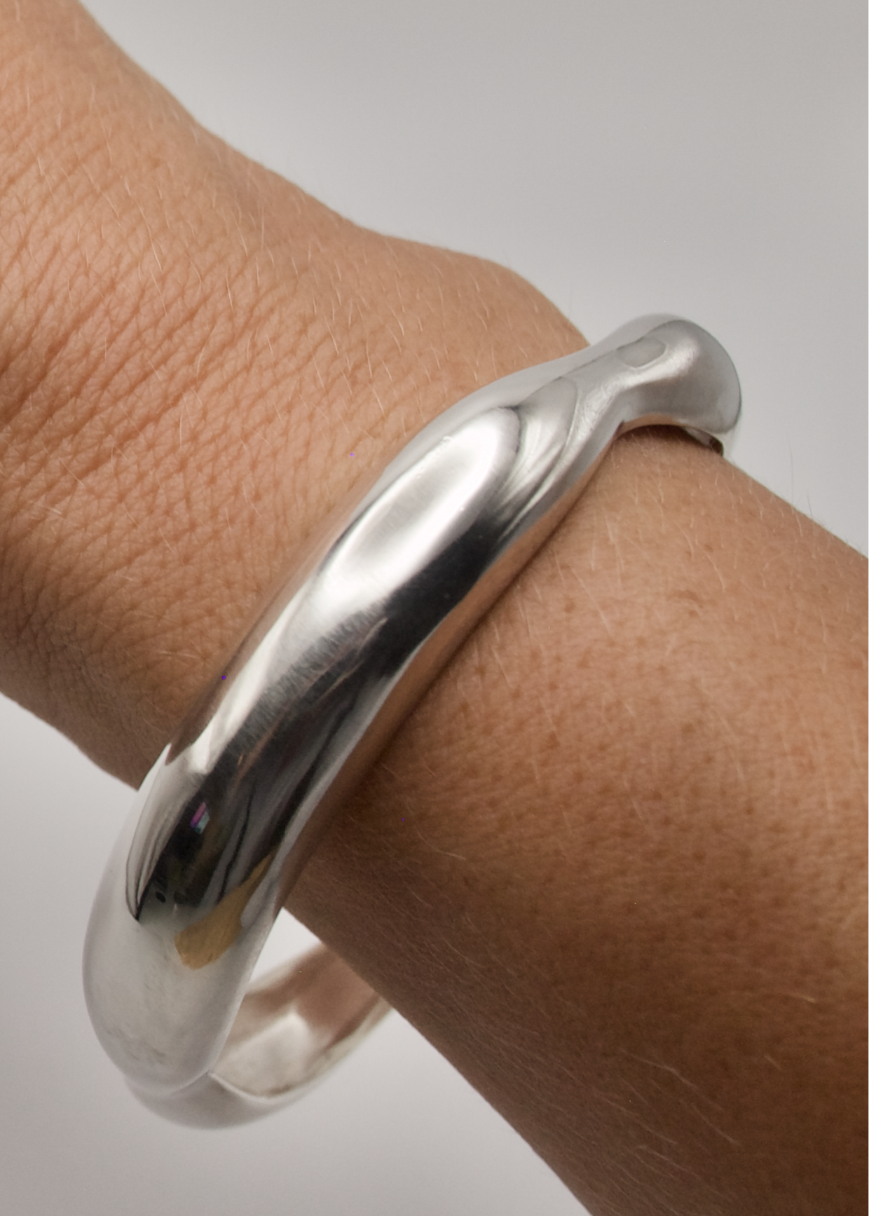 Detailed view of the Agnes Bracelet, focusing on its high-quality 925 sterling silver craftsmanship and reflective surface.