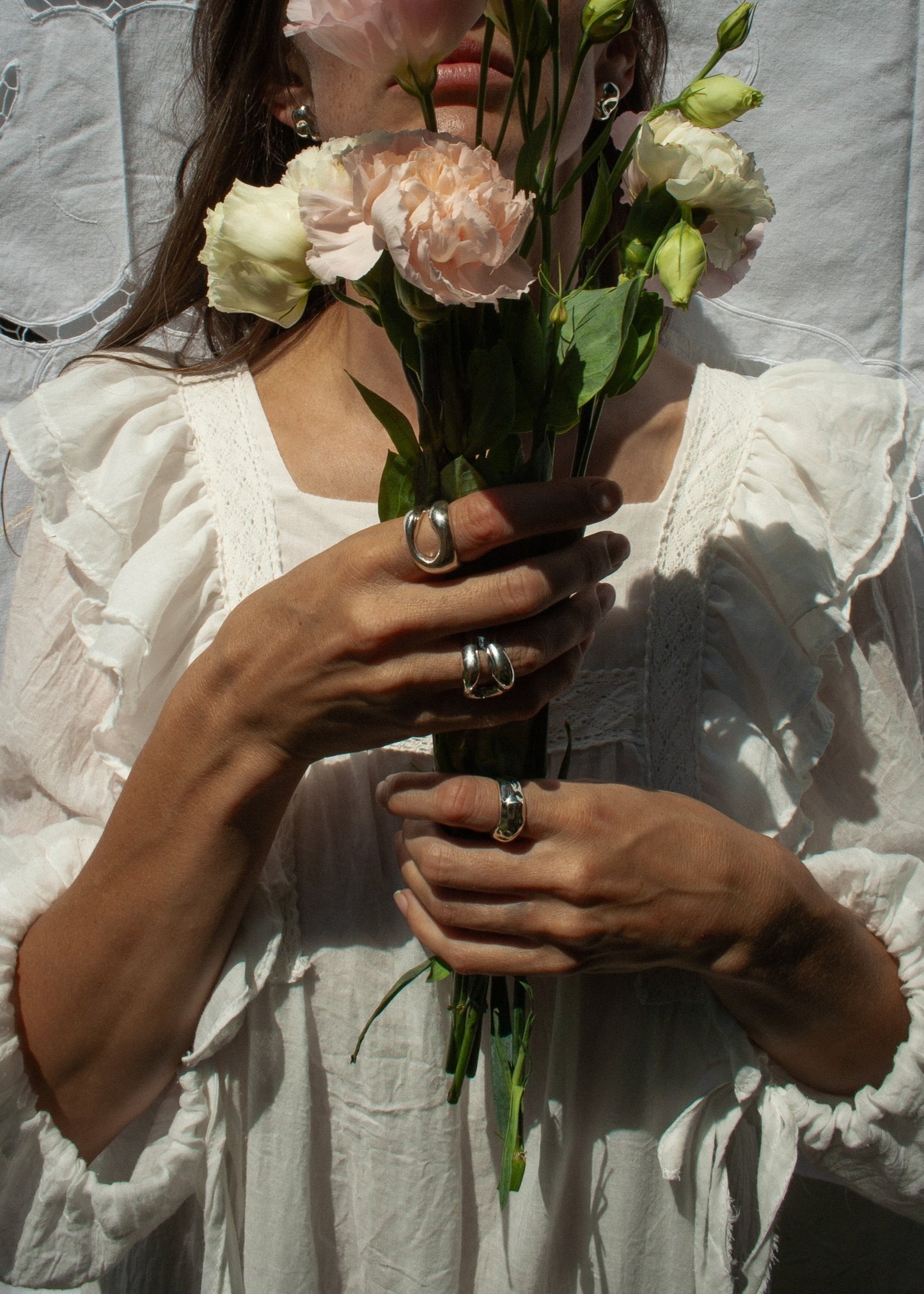 Close-up of a model's hand wearing the Eliza Ring, emphasising its unique design and comfortable fit. sterling silver ring