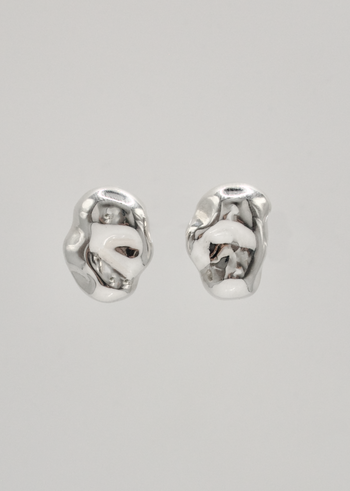 Gaia Earrings – Sterling silver studs with a mirror-polished finish, designed to resemble tiny, reflective stones. perfect for any occasion