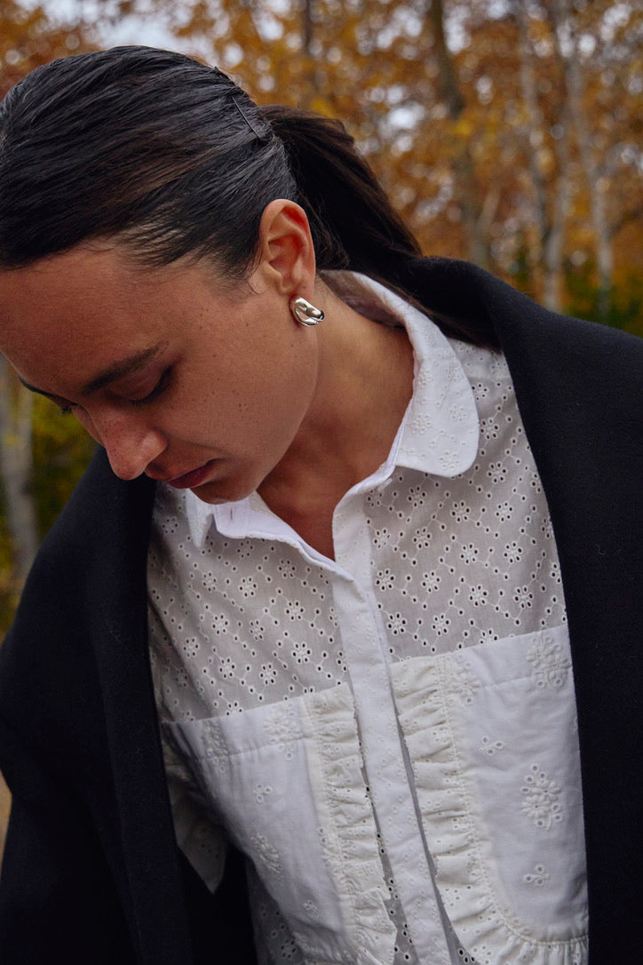 Sculptural silver earrings designed for minimalist elegance, perfect for everyday wear or special occasions.