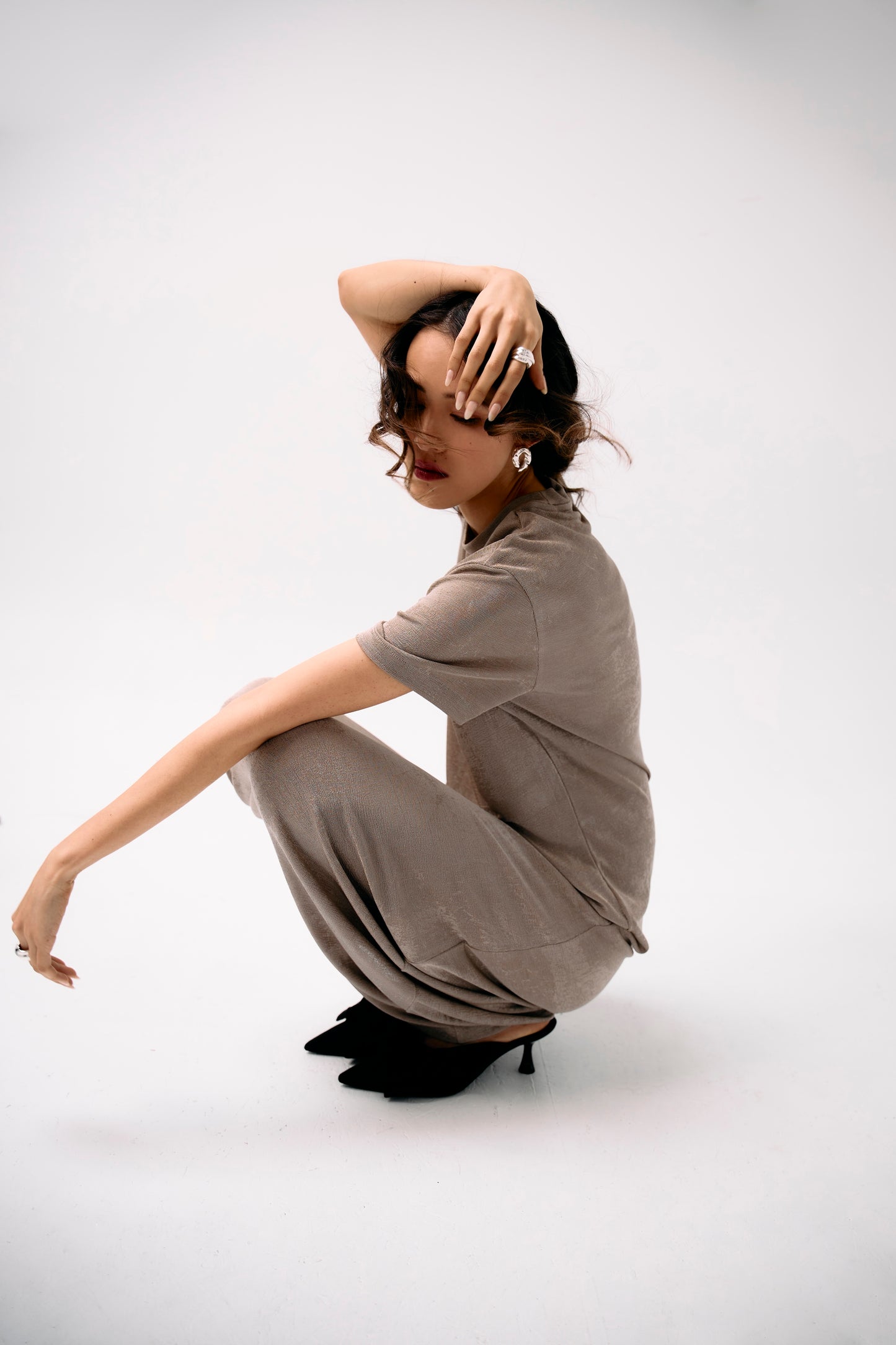 distant view of sculptural silver Marianne ring, handmade with a textured finish ad mirror polish