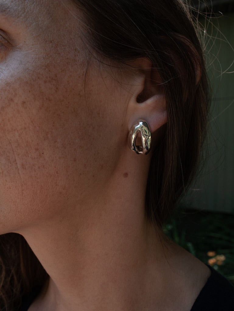 Minimalist sculptural silver earrings, featuring a modern design with timeless appeal. Perfect for adding elegance to any outfit.