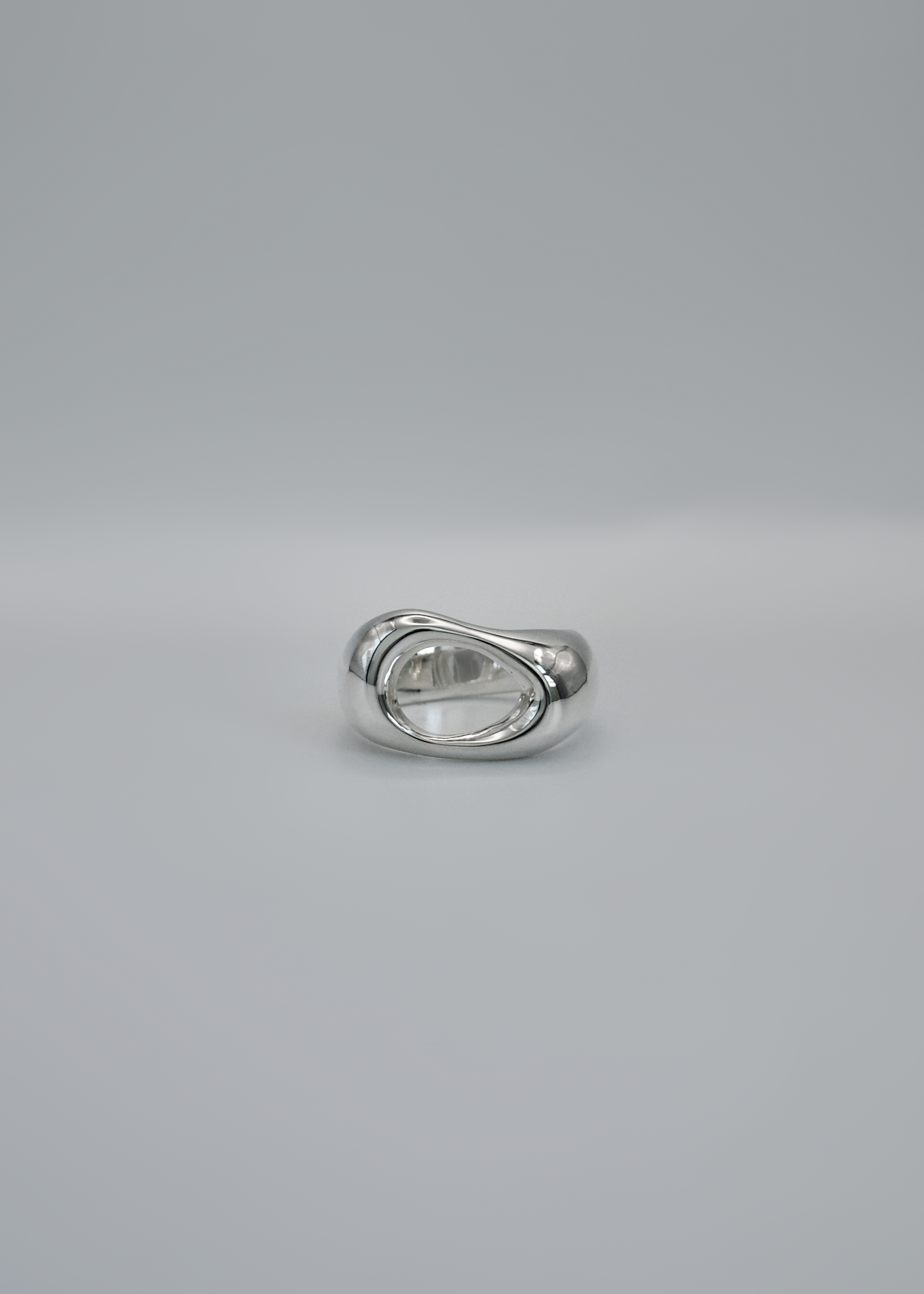 Silver ring on a gray background