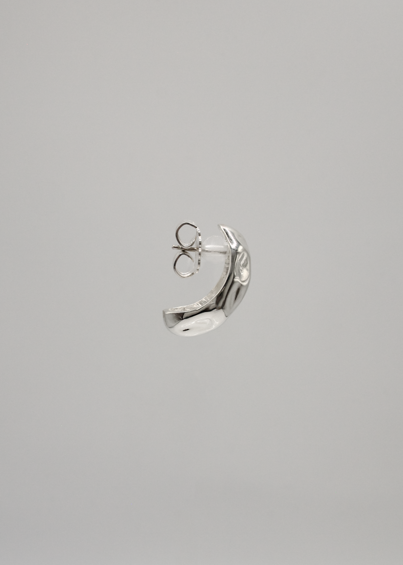 Minimalist sculptural silver earrings, featuring a modern design with timeless appeal. Perfect for adding elegance to any outfit.