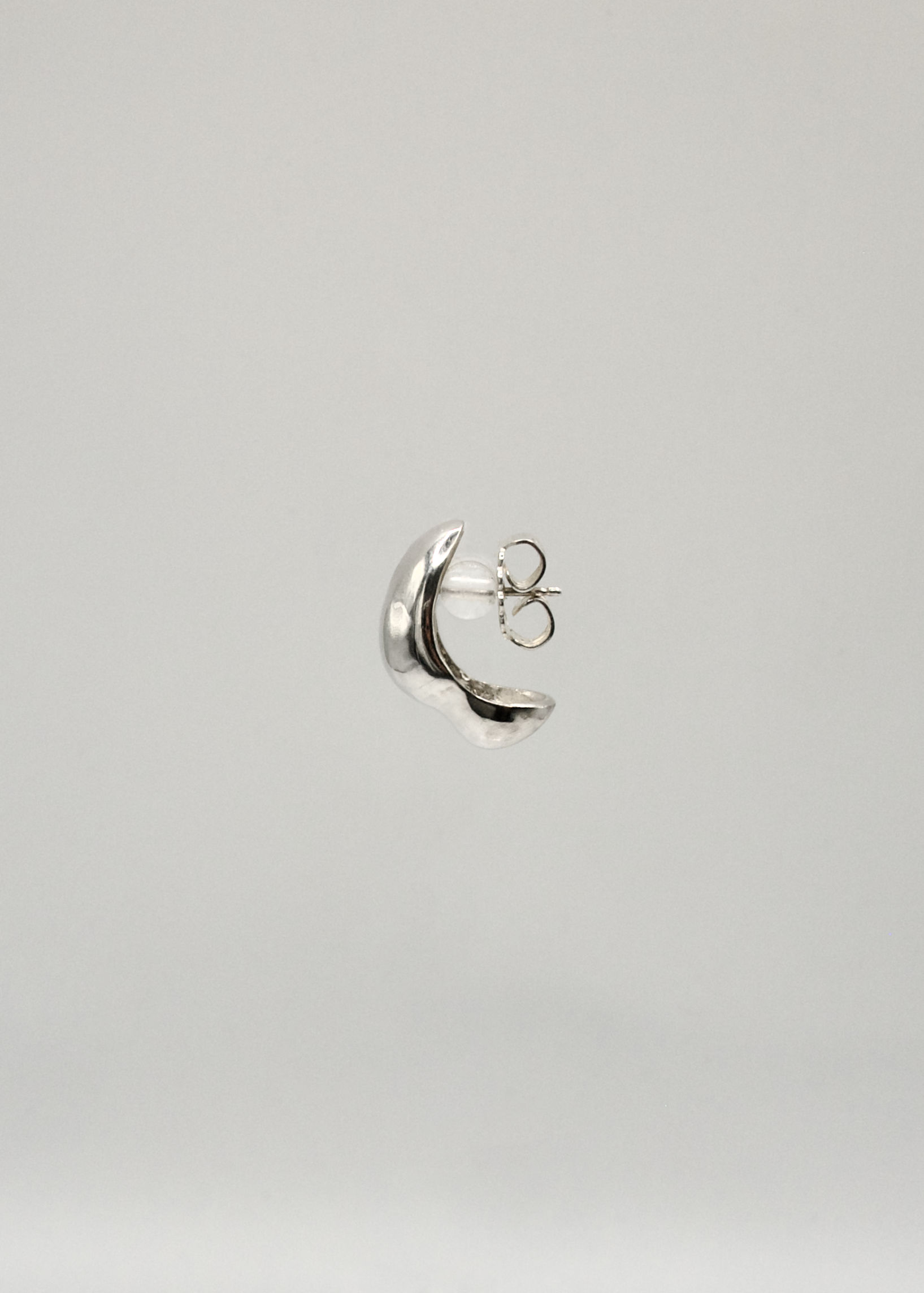 Profile and detailed view of the Sigrid Earrings, focusing on the intricate craftsmanship and reflective surface of the 925 sterling silver.