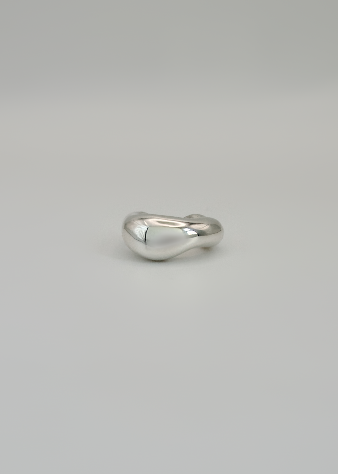 Silver ear cuff narrow option  on a light gray background