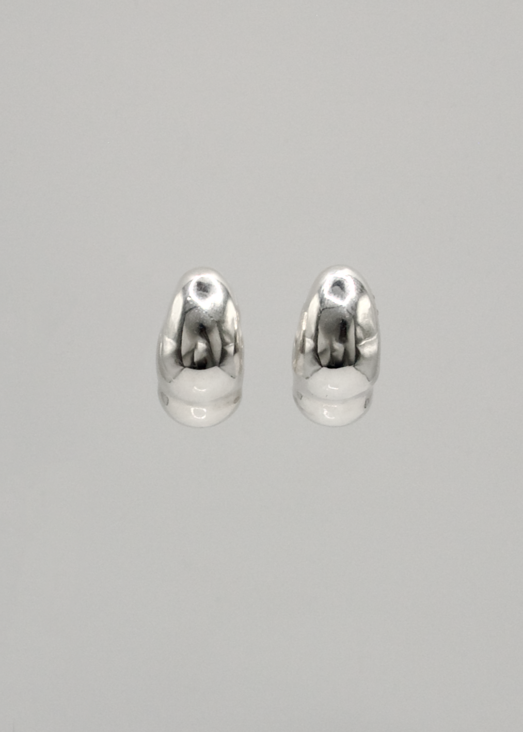 Detailed view of the Sigrid Earrings, focusing on the intricate craftsmanship and reflective surface of the 925 sterling silver.