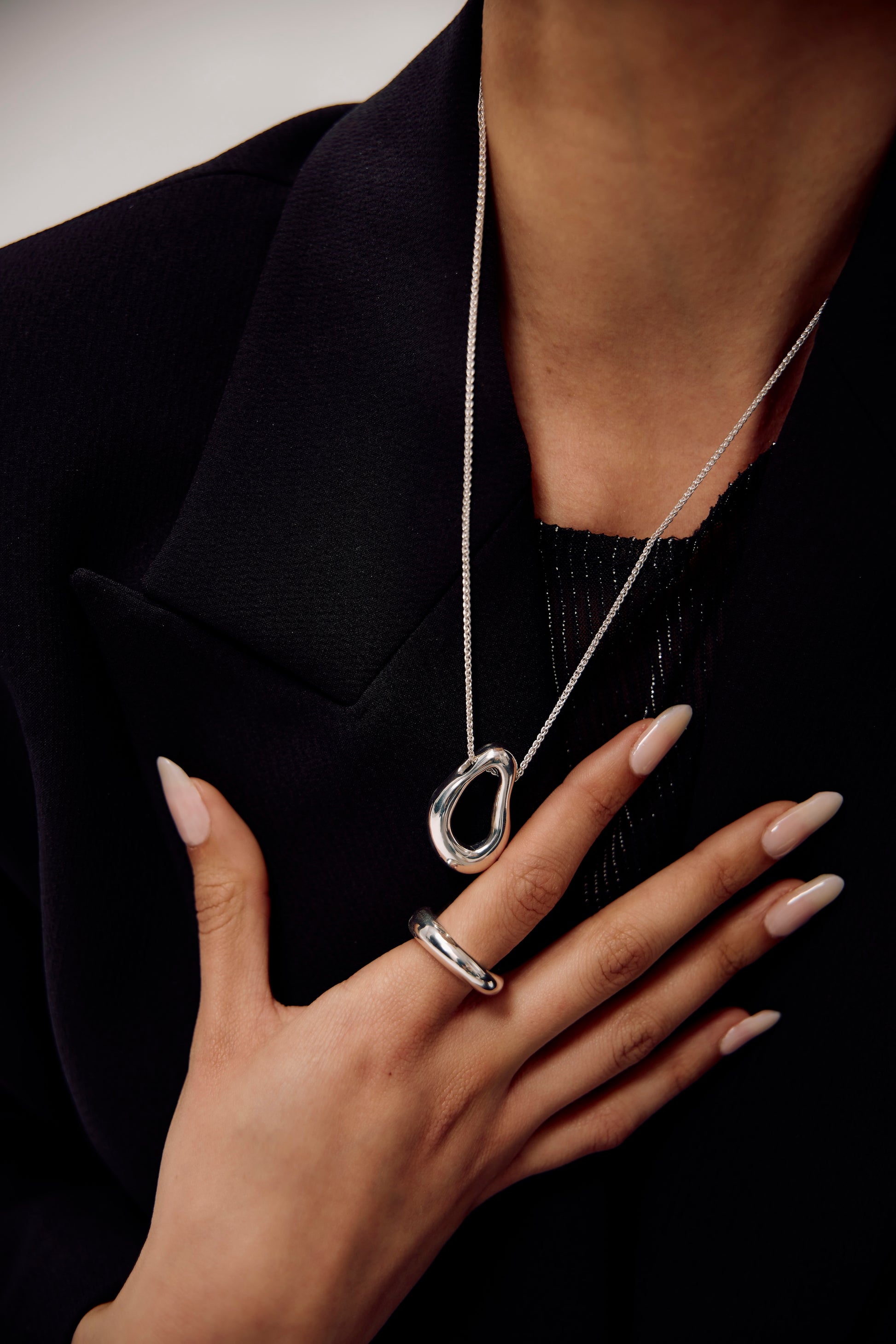 Close up of model wearing sterling silver Andrea pendant from the Allegory collection by SÉOLA Atelier