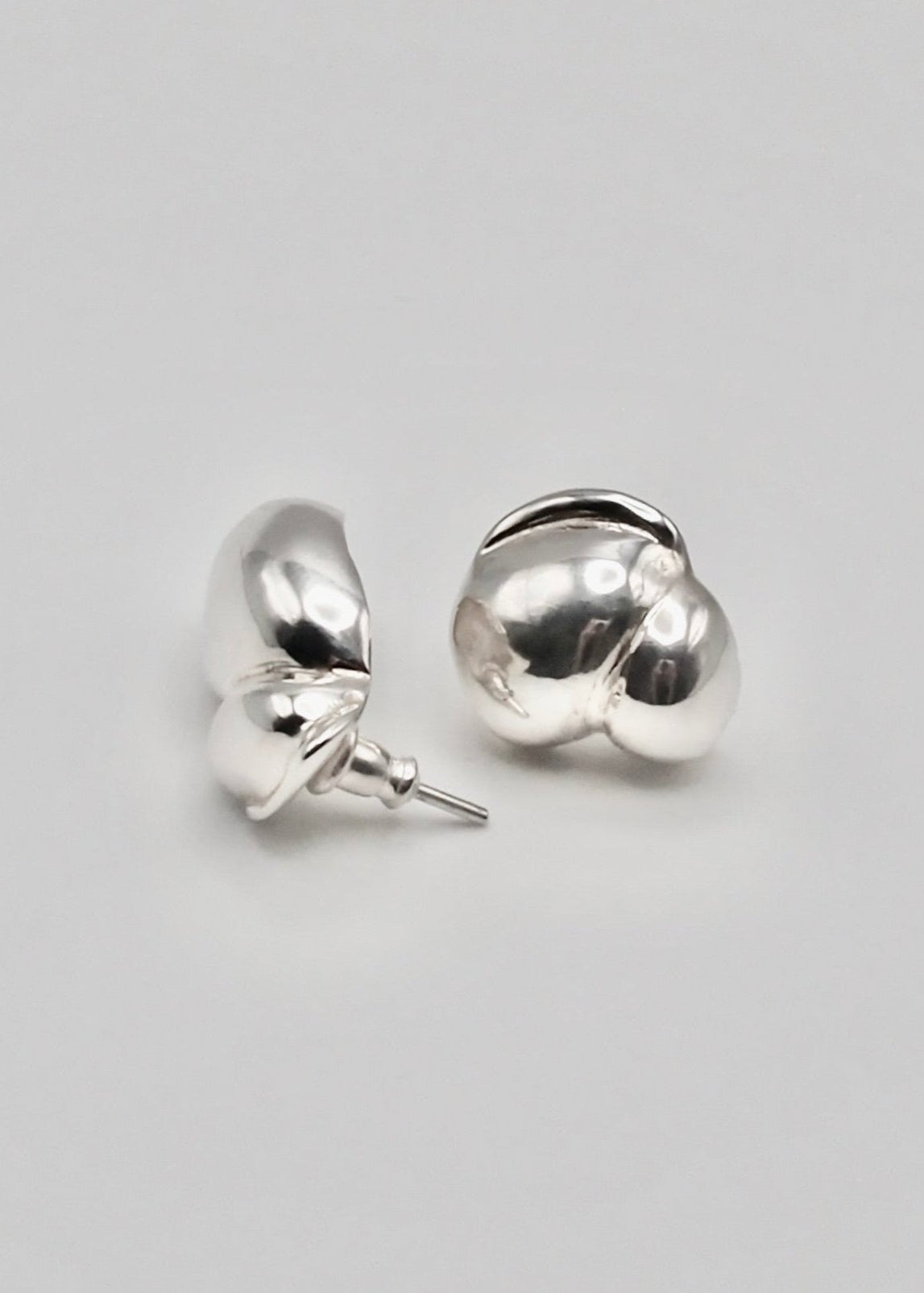 Detailed view of the Camille Earrings, focusing on their intricate craftsmanship and the reflective quality of the 925 sterling silver.