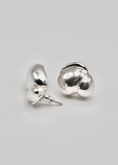 Detailed view of the Camille Earrings, focusing on their intricate craftsmanship and the reflective quality of the 925 sterling silver.
