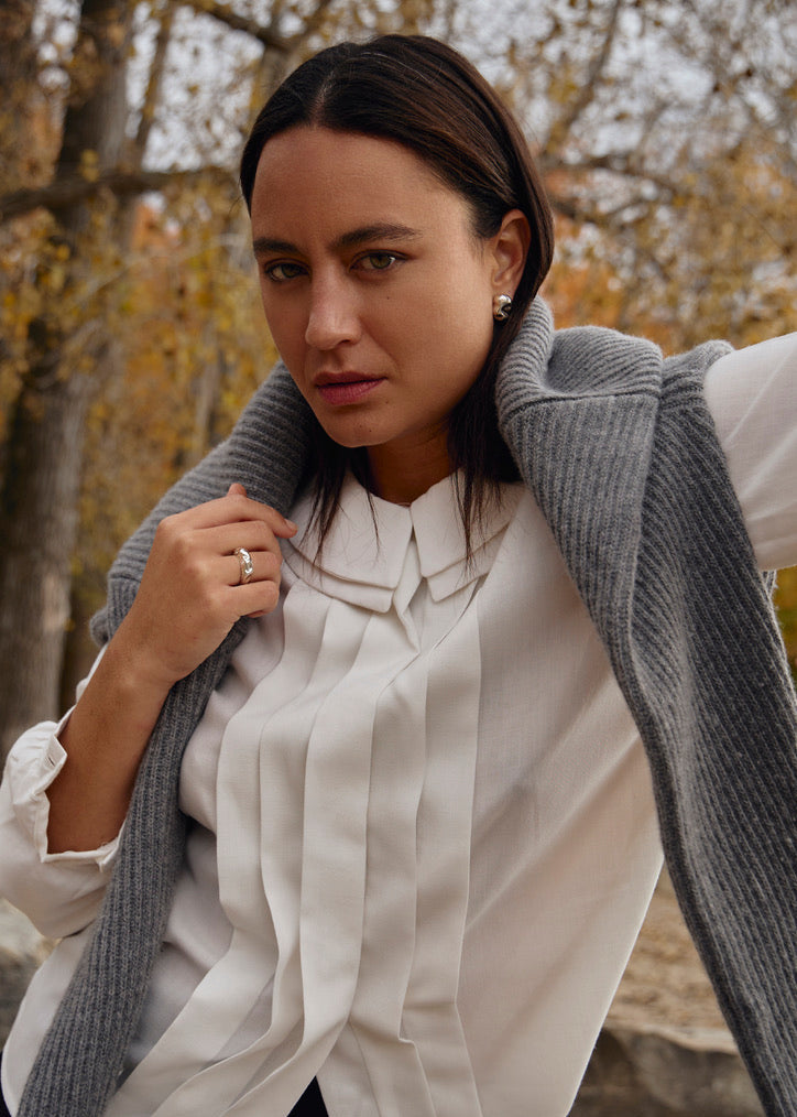 The Esther Ring, measuring 5.5 mm in width and weighing approximately 6.2 grams, is part of SÉOLA Atelier's trio of sister rings, alongside the Astrid and Dagmar rings. Handcrafted from 925 sterling silver with a textured surface and mirror-polished finish, it offers a bold yet refined aesthetic.