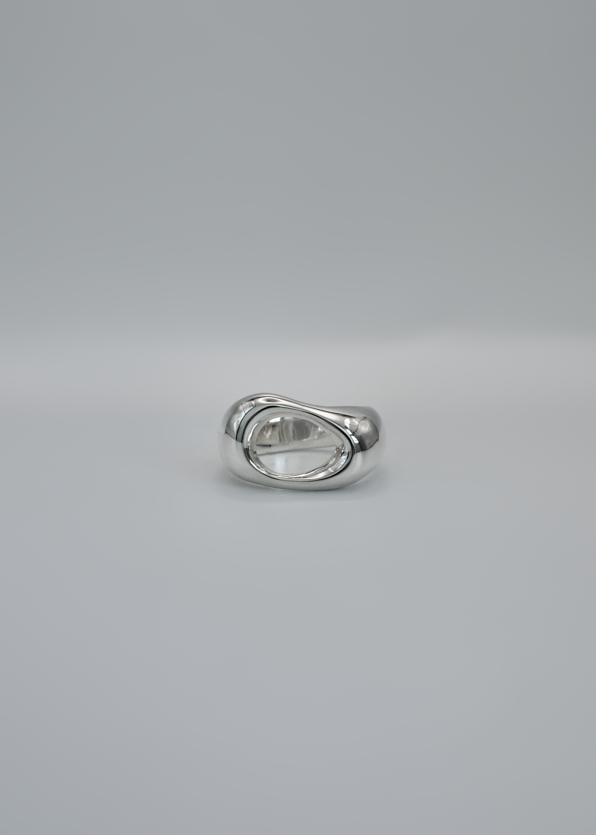 Silver ring on a gray background