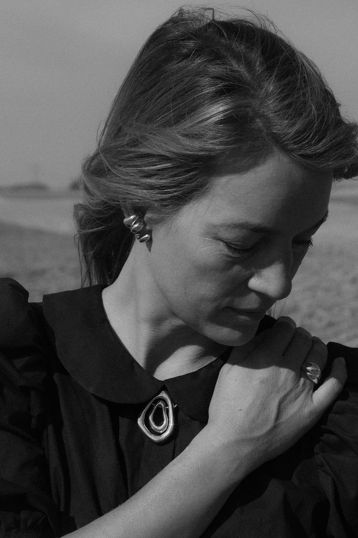 Black and white portrait of a woman with a blurred background