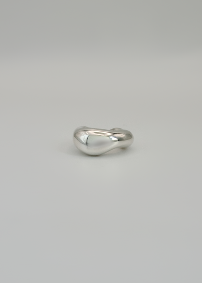 Silver ear cuff narrow option  on a light gray background