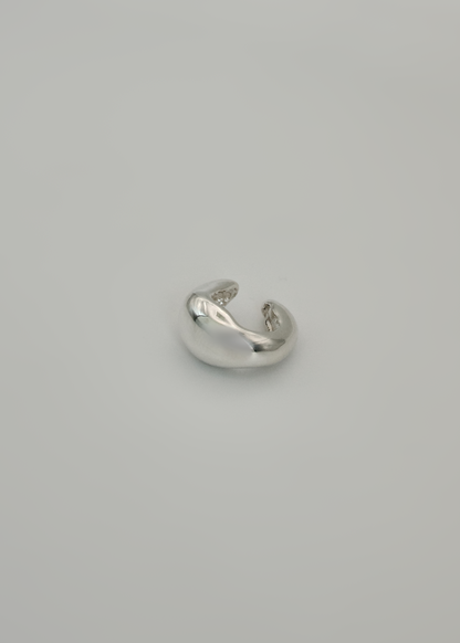 Silver earring cuff ( wide option) on a light gray background